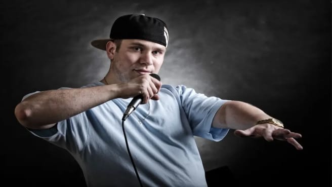 A cool rap singer dancing in a typical rap style.