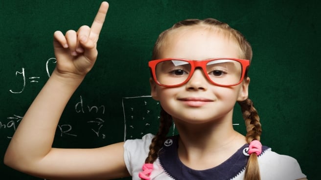 A funny girl with red glasses teaches Algebra.