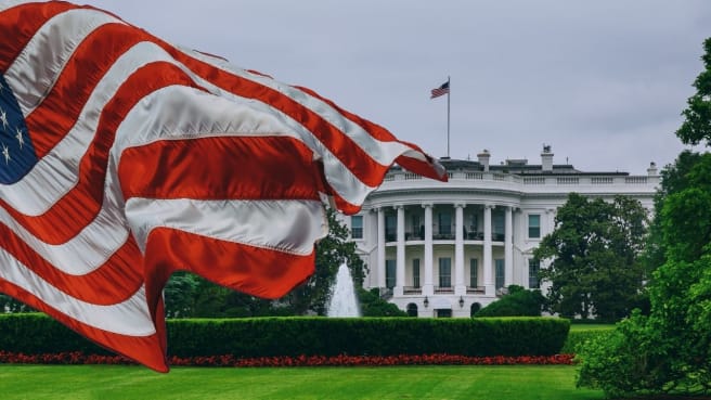 American (US) Politics - the White House with the united states flag.