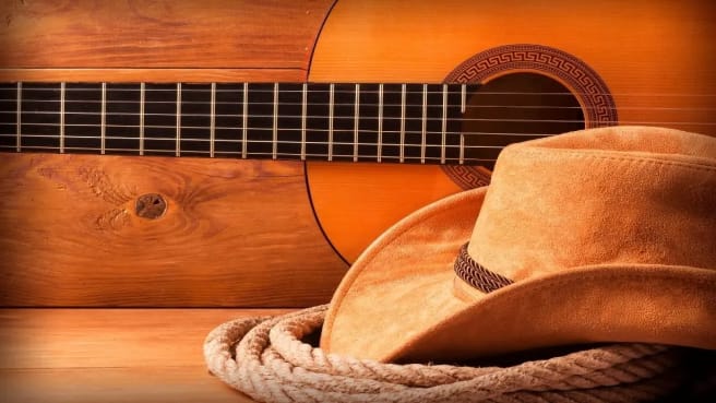 A guitar and cowboy hat are part of Country Music.