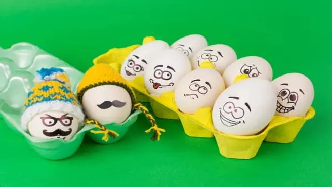 Cool hipster Easter eggs with funny knitted hats.
