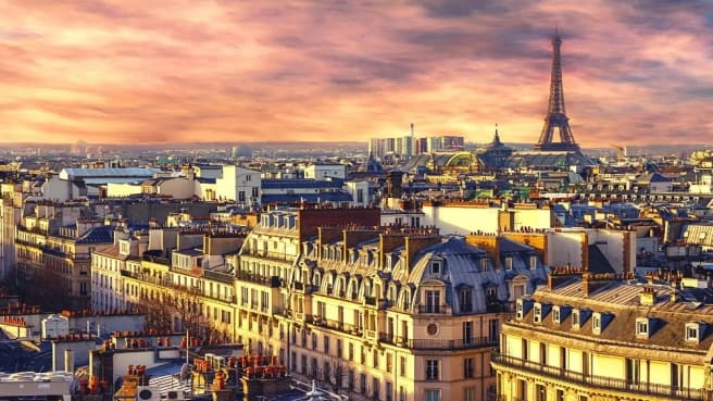 Paris and the Eiffel tower in France at twilight time.