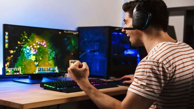A man playing a video game on the PC.