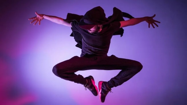 Hip hop dancer jumping in the air.