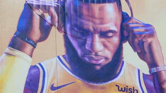 LeBron James in the Lakers uniforms, with his headphones.