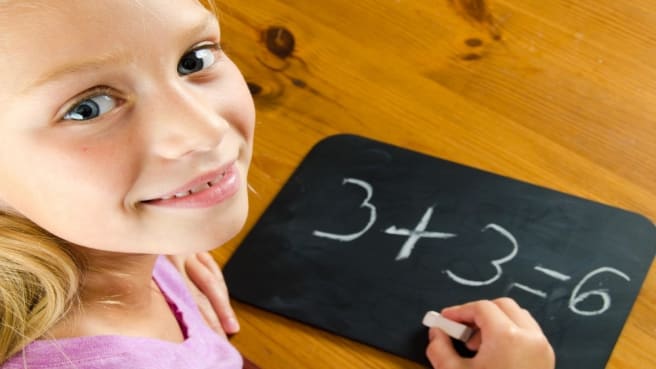 A little girls learning math.