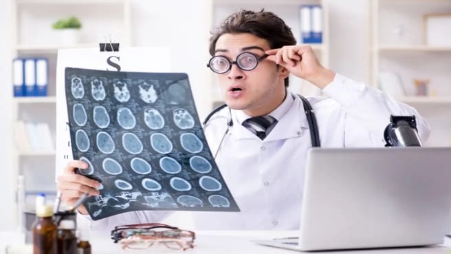 A funny medical doctor holding x-ray results.