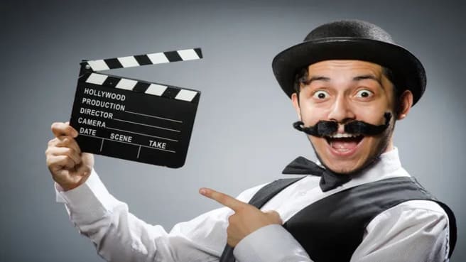 Funny man with a hat and movie clapper board.
