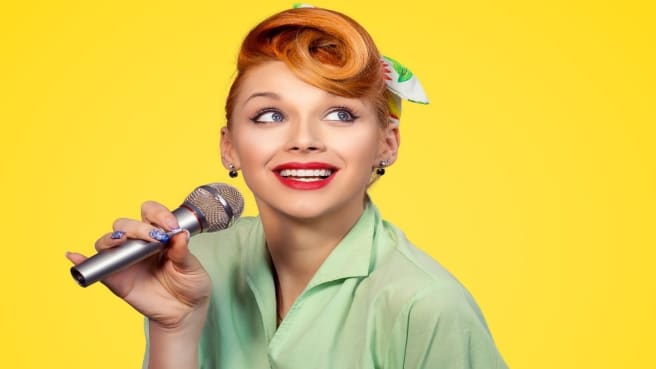 A retro singer singing to music sounds.