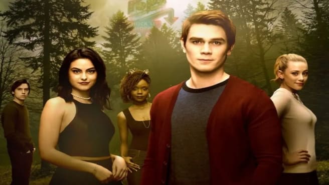 Riverdale characters are standing in the woods.