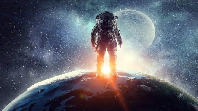An astronaut standing on Earth and looking at the space and the moon.