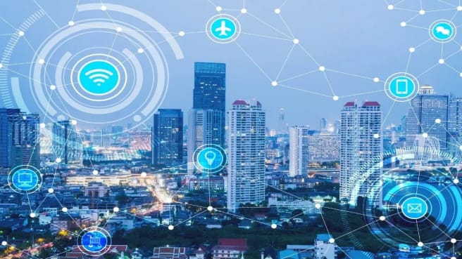 A photo of a city with symbols of the technology it uses.