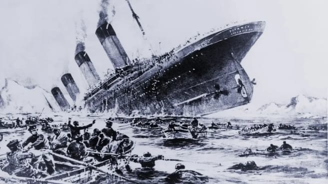 The Titanic sinking in a black and white photo.