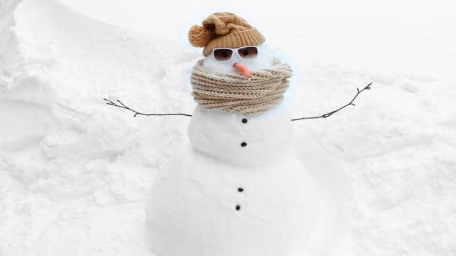A funny snow man in the winter.