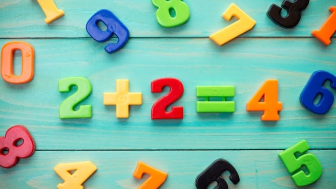 Numbers on a table creating a math formula.
