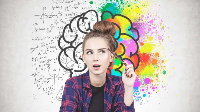 A woman smiling and thinking about brain games