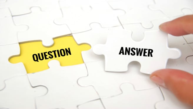 A missing puzzle piece with the word "answer" on an empty place with the word "question".