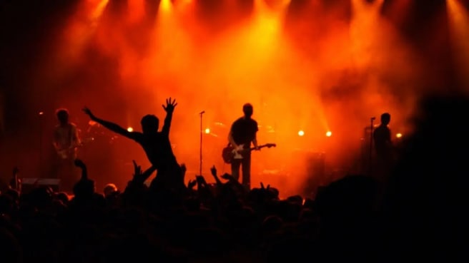 Music band on a stage during a music concert.