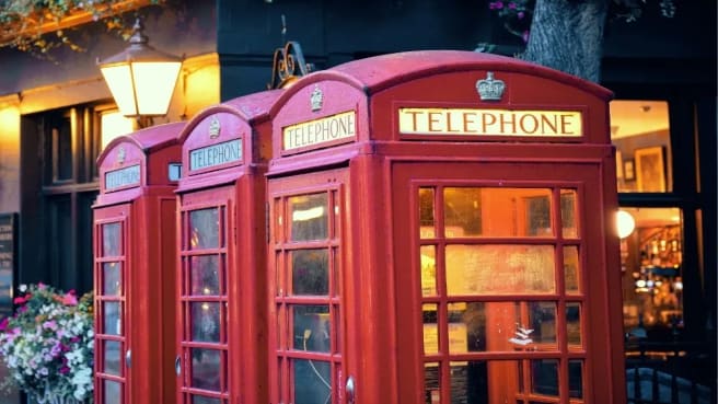 A Red telephone booth, typical in great Britain.