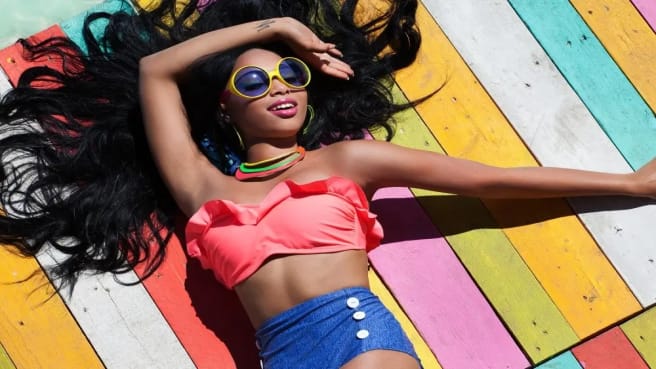 A fashion model on a colorful wooden deck.