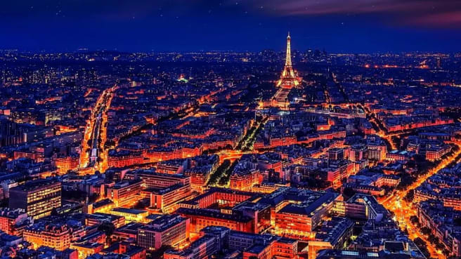 Paris and the Eiffel tower at night time.