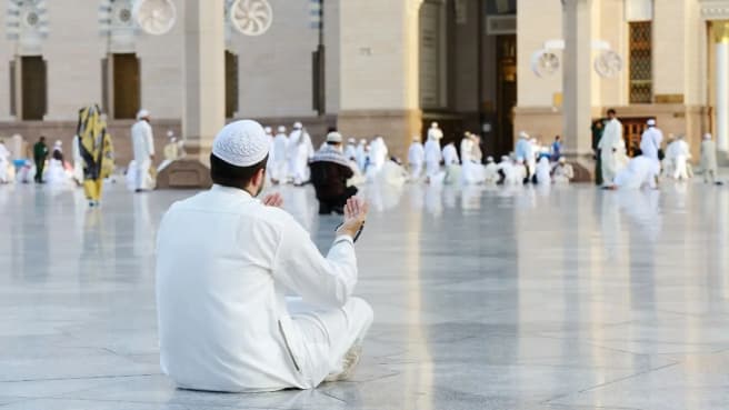 Islam - Islamic people pray in the mosque.