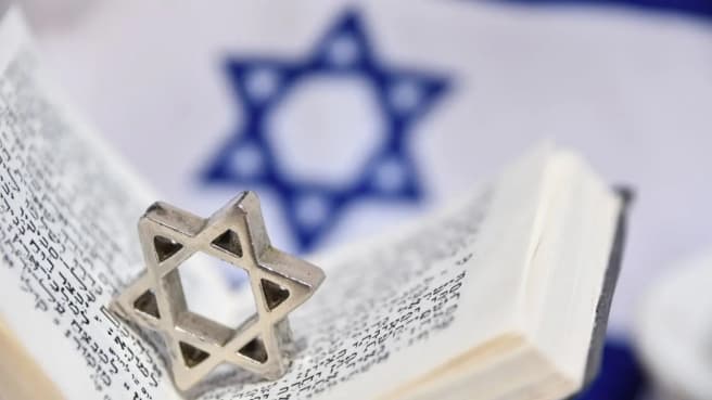 Judaism - the Bible and the Israeli flag.