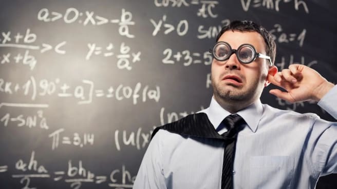 A funny math teacher with a black math chalkboard.
