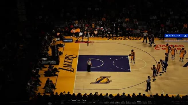 Two NBA Teams playing on the Lakers court.