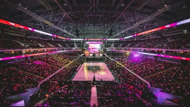 Basketball stadium full of fans during an NBA game.