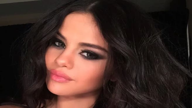 Selena Gomez smiling at the camera.