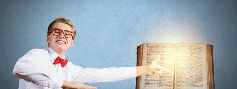 A funny nerd boy pointing at a glowing book that teaches general knowledge.