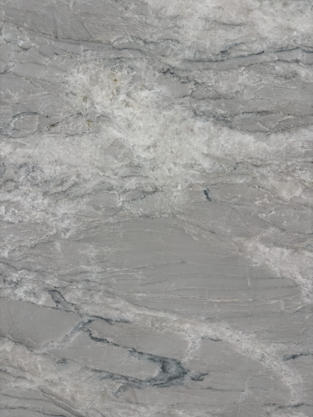 Crystal Spectrum quartzite block 36915 detail, white crystalline surface with grey flow and teal-blue mineral streaks