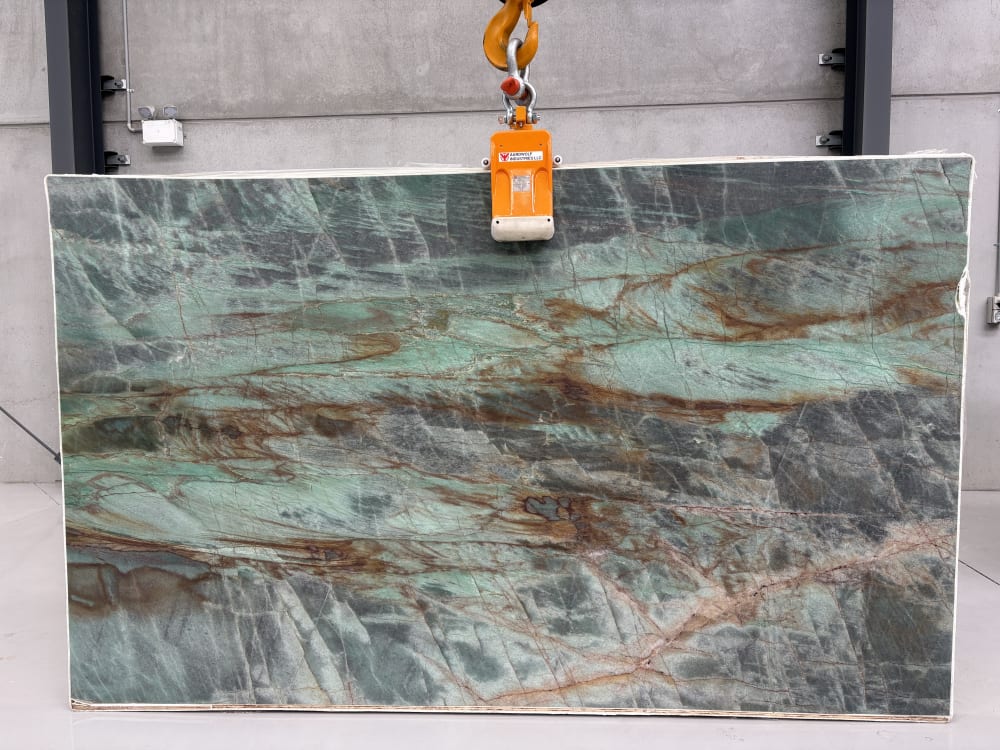 Sauipe quartzite full slab, honed emerald-green with charcoal-grey passages and copper veining