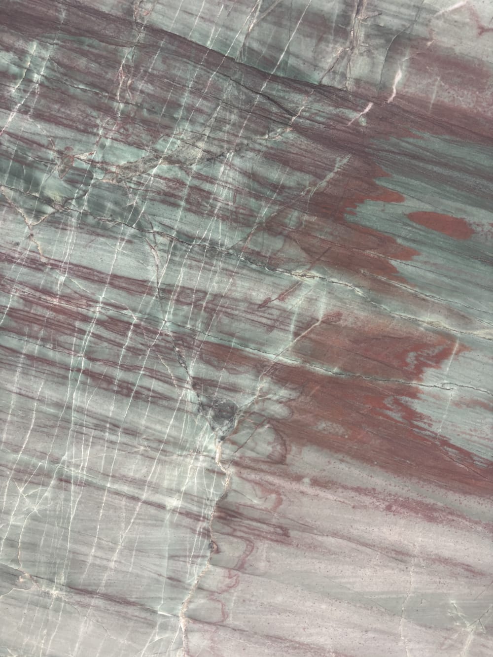Green Valley quartzite detail, green and burgundy movement with fine white crystalline threading through