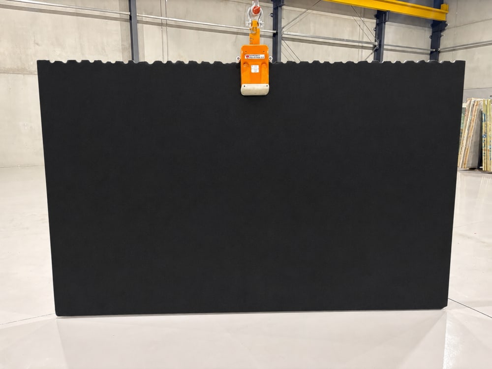Brazilian Black granite full slab, leather finish deep near-solid black with soft tactile texture