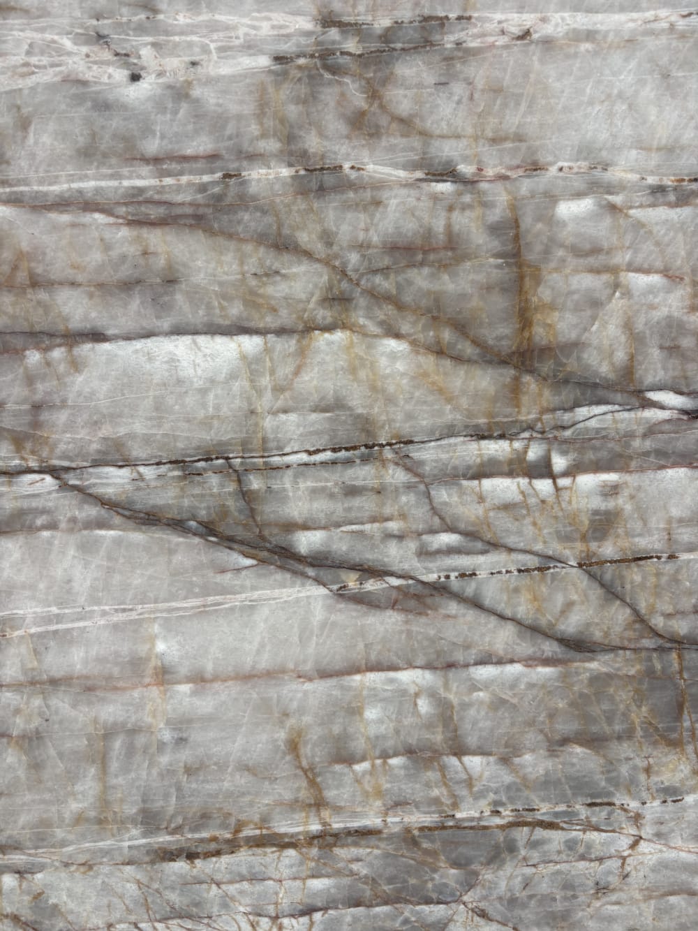 Valentine Crystal quartzite detail, fine rust-red hairline veining across a grey-taupe ground