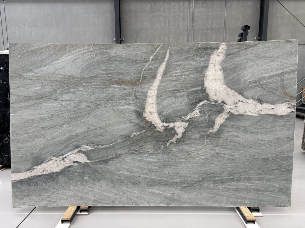 Tiffany quartzite full slab, honed and polished grey linear movement with a bold branching quartz vein