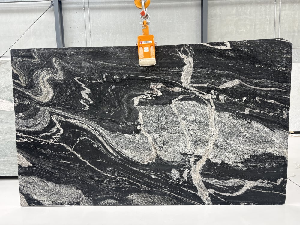 Black Storm granite full slab, leathered dense black with sweeping white and grey quartz movement