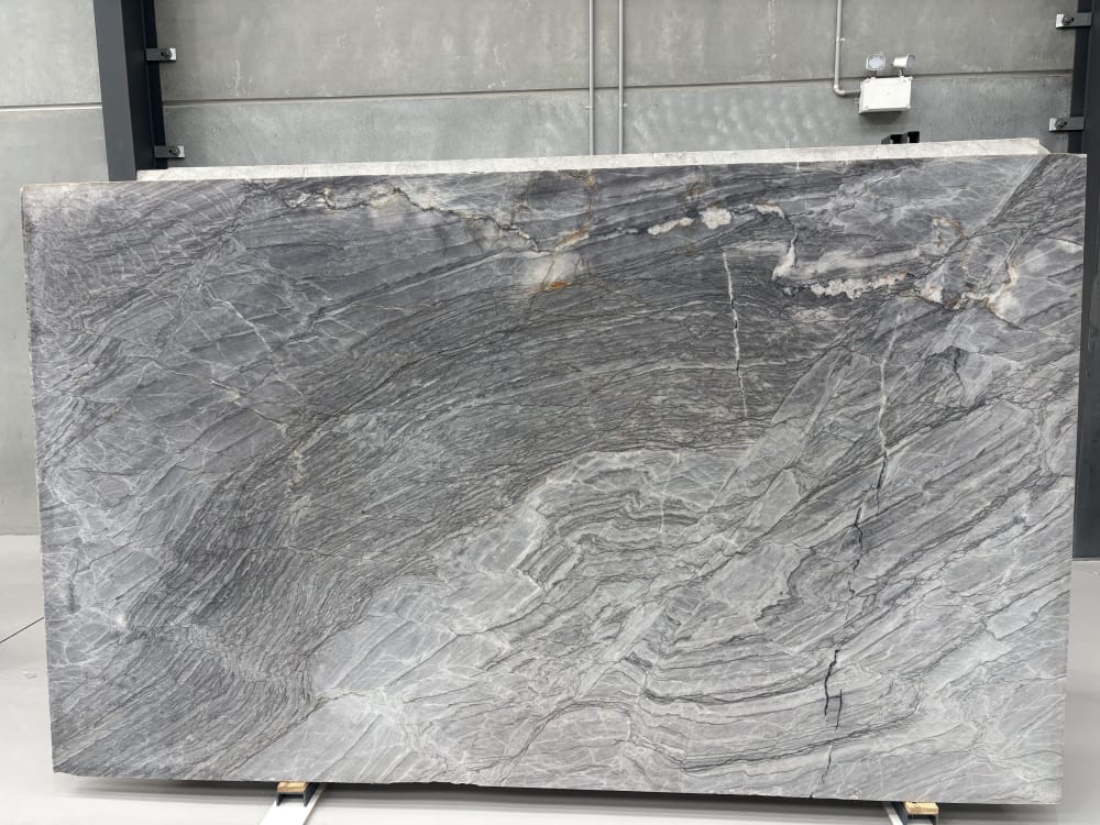 Manhattan quartzite full slab, honed deep blue-grey with sweeping smoke-like diagonal movement