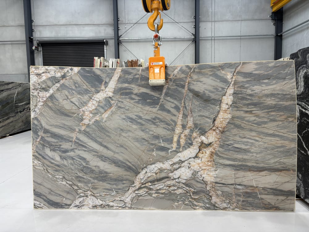 Crystal Verde quartzite full slab, honed grey-green with a copper-edged white quartz vein sweeping across it