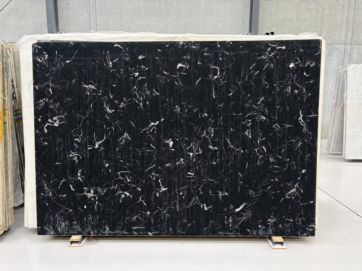 Black Tornado marble full slab, dense black ground with a fine web of sharp white veining
