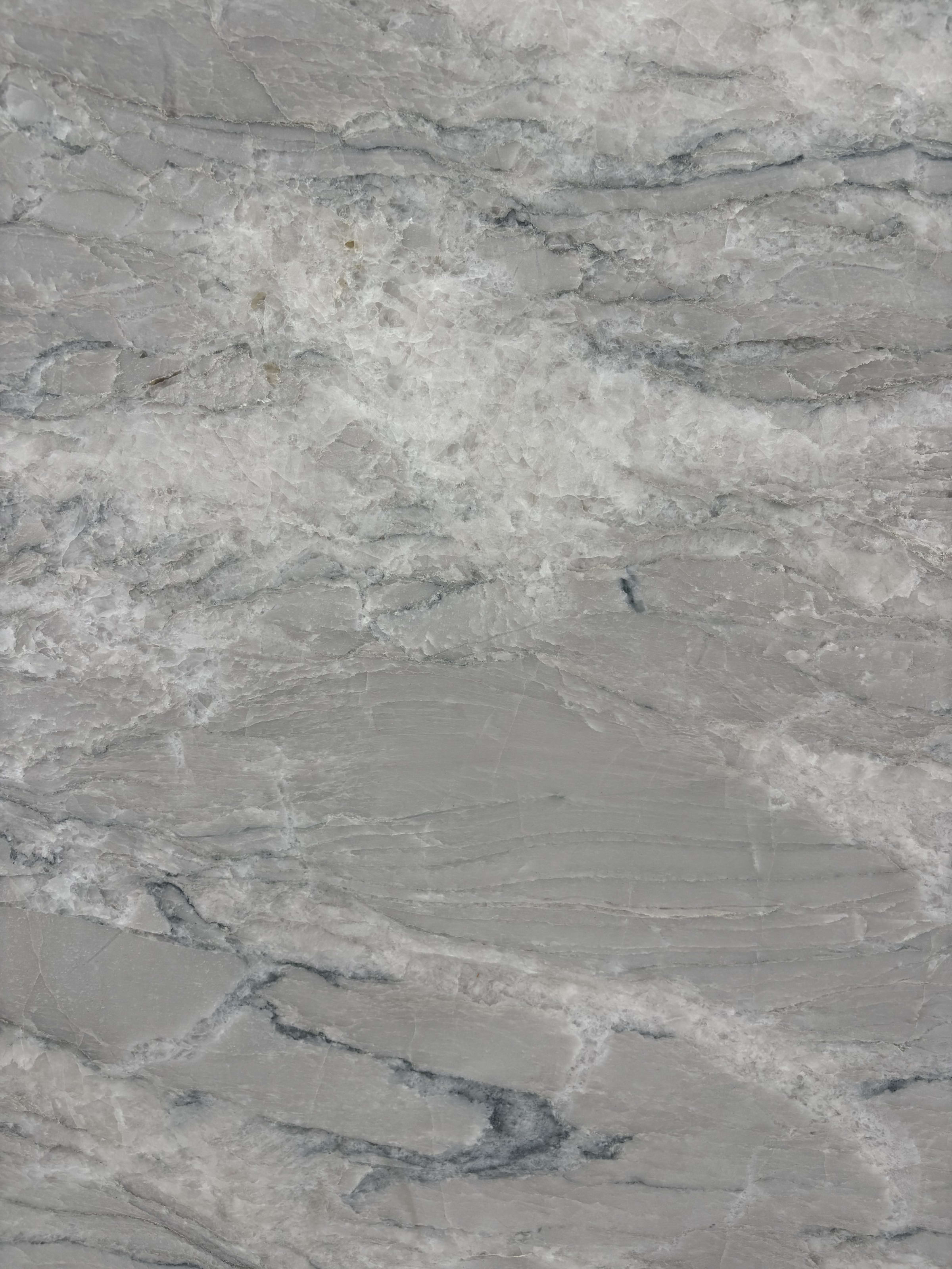 Crystal Spectrum quartzite block 36915 detail, white crystalline surface with grey flow and teal-blue mineral streaks