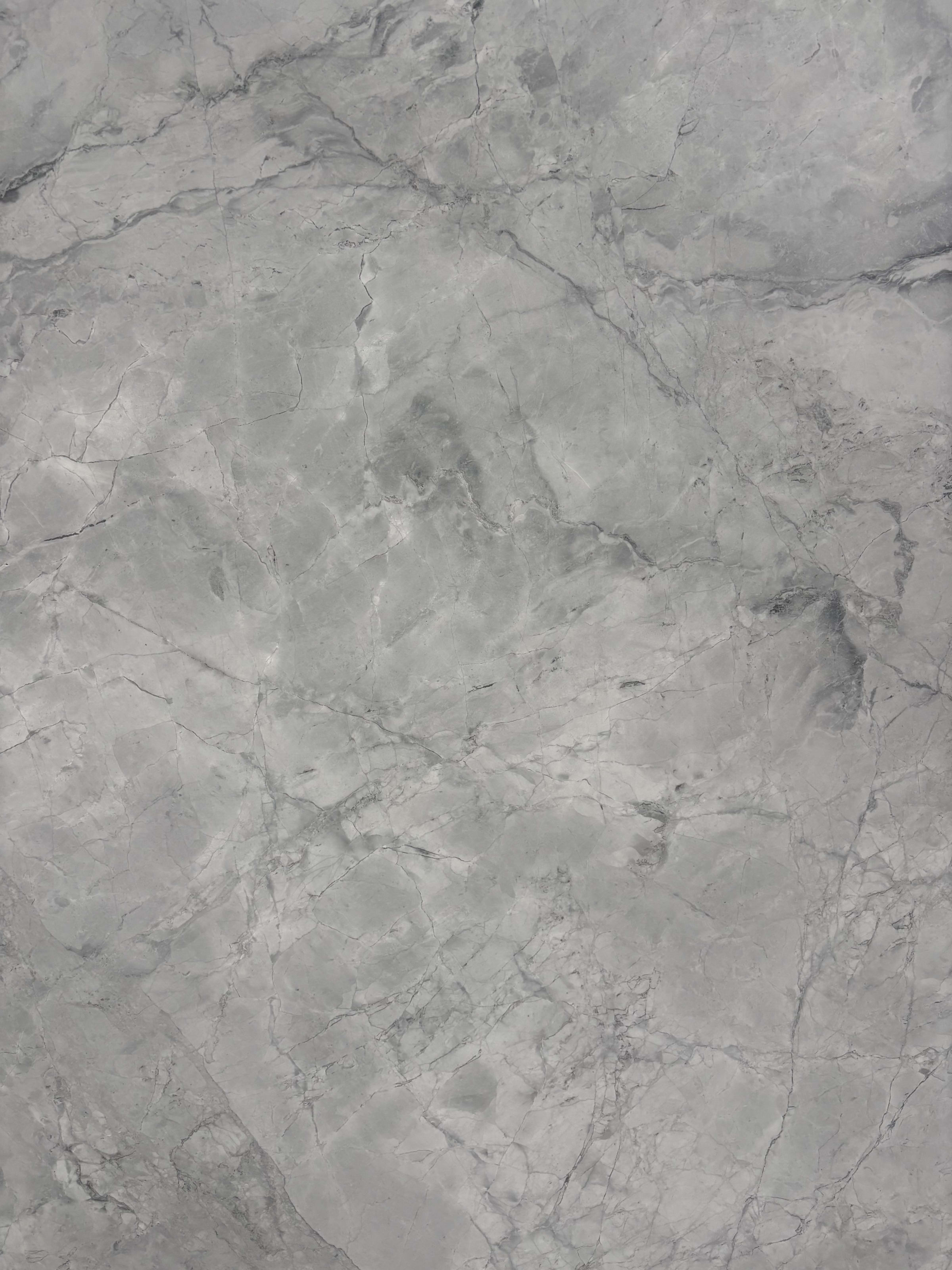 Super White dolomite detail, bright white ground with soft grey cloud movement