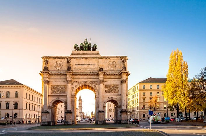 Siegestor triumphal arch in Munich framed by autumn trees