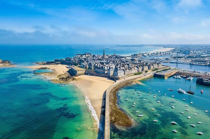 Aerial view of Saint-Malo’s walled old town and turquoise harbour