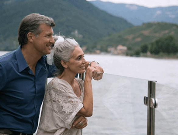 Imagea of a couple looking out to the river 