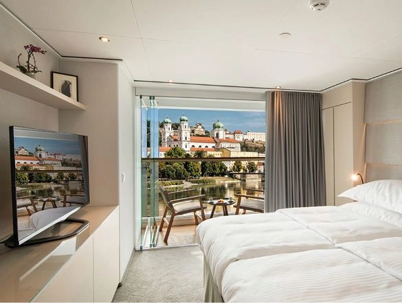 Grand Balcony suite with the window open in Europe