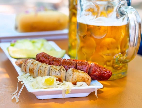 Gourmet German bratwurst with sauerkraut and a stein of beer