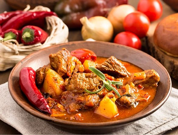 Traditional Hungarian goulash with fresh vegetable ingredients